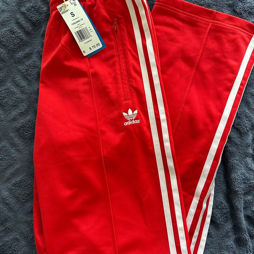 WOMEN’S RED ADIDAS CLASSICS FIREBIRD
TRACK PANTS SIZE SMALL